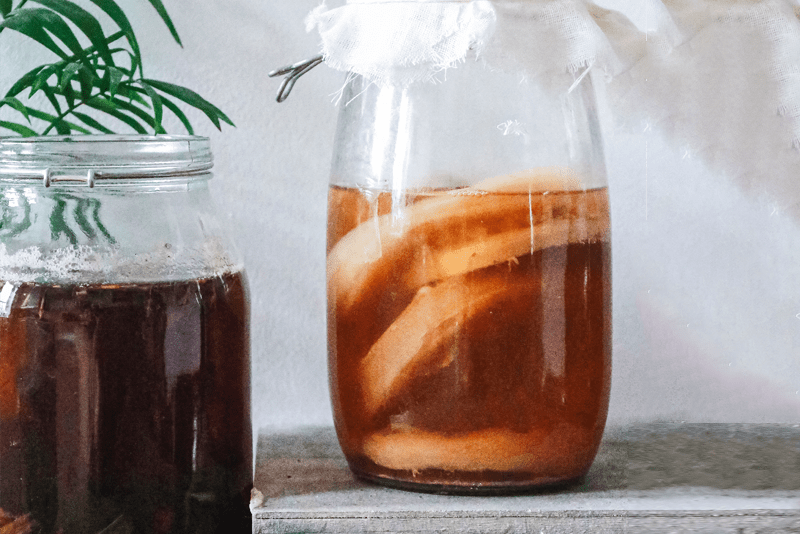 kombucha benefits, homemade jars of kombucha